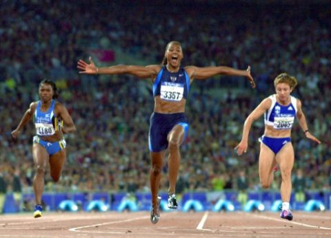 Marion Jones, victorieuse du 100m aux JO de Sydney, le 23 septembre 2000 - Jeff Haynes - AFP