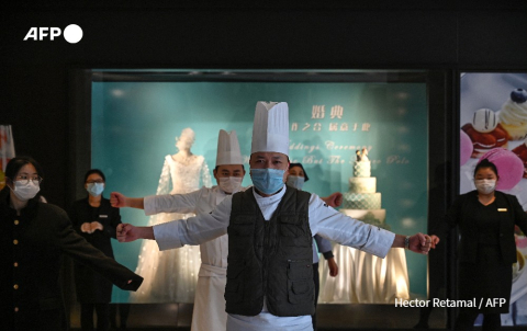 Gymnastique des employés de l'hôtel Marco Polo de Wuhan, 28 janvier 2020 - Hector Retamal - AFP