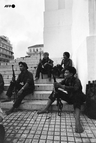 Soldiers of the National Liberation forces (NLF) guard in Saigon on April 30, 1975 - AFP