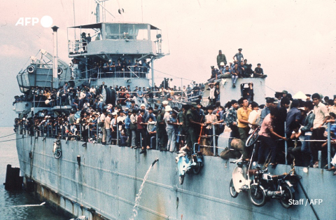 Jampacked with more than 7,000 refugees, South Vietnamese Navy ship HQ-504 arrives at Vung Tau, South Vietnam - AFP