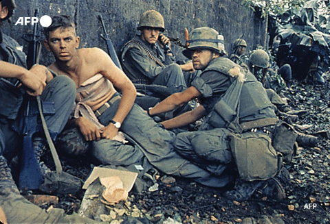 D.R. Howe treats the wounds of Marine Private First Class D.A. Crum during Operation Hue City in Vietnam on February 6, 1968. AFP