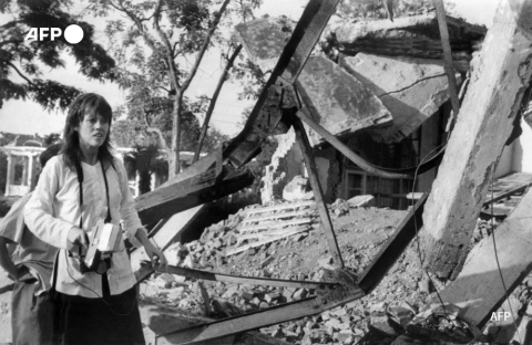 Jane Fonda visits on July 25, 1972 a Hanoi site bombed by US airplanes. - AFP