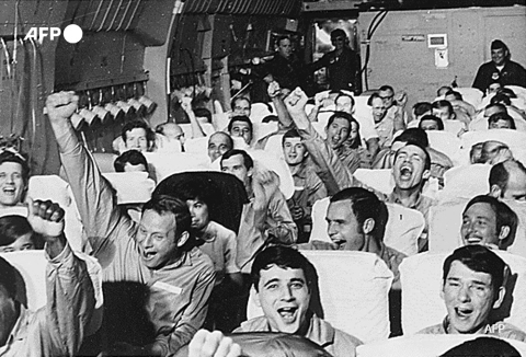 US servicemen who had been held as prisoners of war cheer as their plane takes off from an airfield near Hanoi, Vietnam as part of Operation Homecoming in February 1973 - AFP