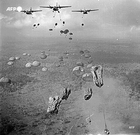 Vietnamese paratroopers jump from US Air Force C-123 transport planes in March 1963 - AFP