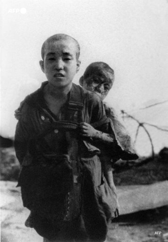 Two brothers who survived the Hiroshima bombing, in a photograph dated August 10, 1945 - AFP