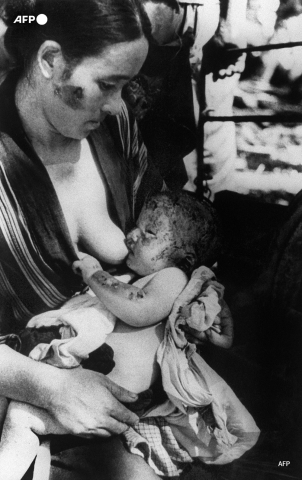 A woman and child in Hiroshima in August 1945, days after the bombing - AFP