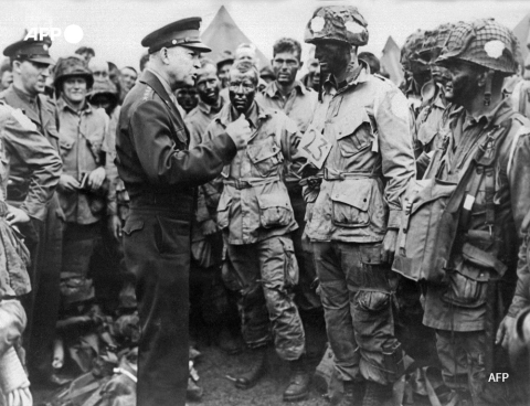 General Dwight Eisenhower (L) speaks with paratroopers in England before the D-Day invasion in June 1944 - AFP